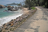 seychellesSeychelles. Futile protective stone wall by roadside