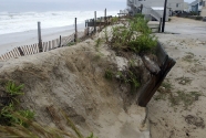 An area where the Atlantic Ocean breached a sea wall at the end of Leeward Ave which allowed the surf to flow down to Bay Avenue in the wake of Hurricane Irene on Long Beach Island, Sunday Aug. 28, 2011 in Beach Haven, N.J.  (AP Photo/Joe Epstein)
