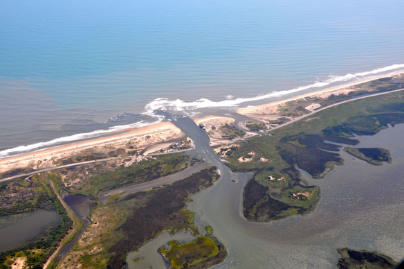 Shore towns use sand dredged from inlets to widen beaches
