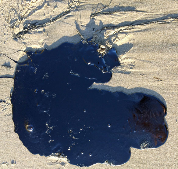 Oil spills on the worlds beaches and in the worlds oceans
