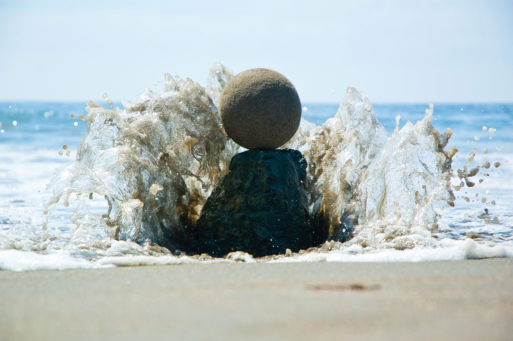 “Afternoon, Muir Beach, California. Sand globe perched on a rock as the tide comes in;”  By Zach Pine