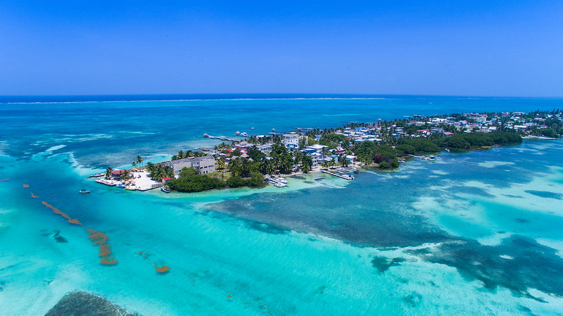 Aerial view of the Caribbean Sea and the Split in Caye Caulker, Belize (by Falco Ermert CC BY 2.0 via Flickr).