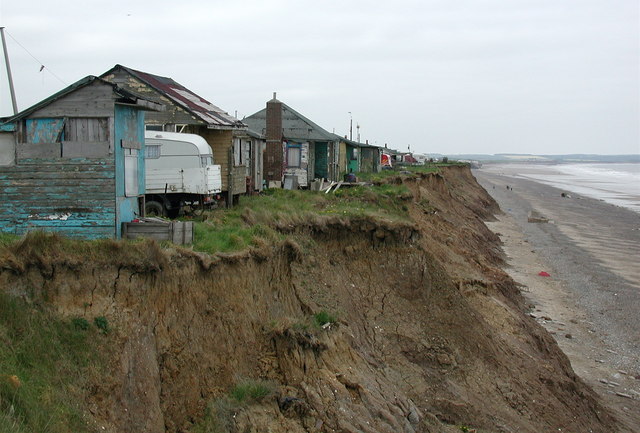 Chalet style cottages perched precariously on the North Sea cliff, south of the old Hornsea Road at Skipsea (© Paul Glazzard CC BY-SA 2.0 via Geograph).