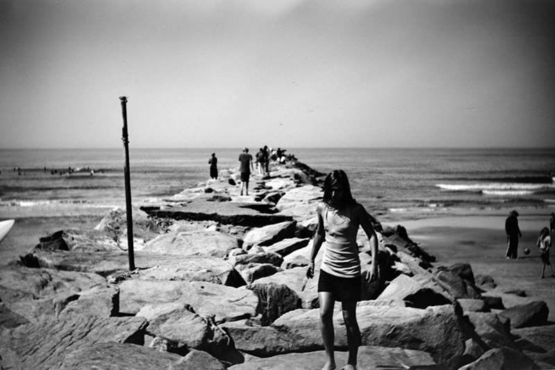 Girl on the Jetty, Oceanside, California - April 18, 2009 (by Brian Auer CC BY-NC-ND 2.0 DEED via Flickr).