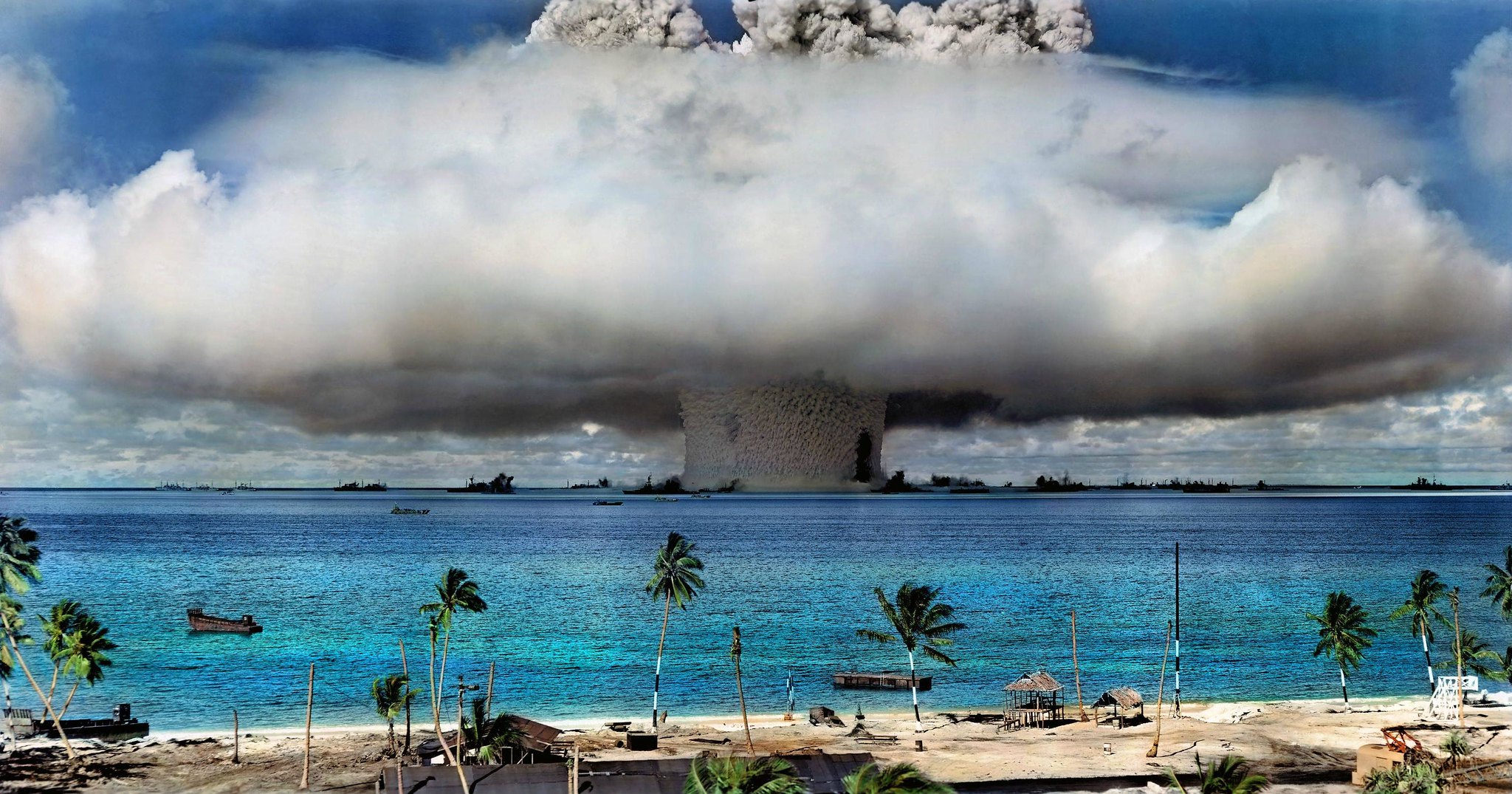 Colorized image of US nuclear weapons test at Bikini Atoll in the Marshall Islands in 1946 (original photograph by US Defense Department colorized by the International Campaign to Abolish Nuclear Weapons CC BY-NC 2.0 DEED via Flickr).
