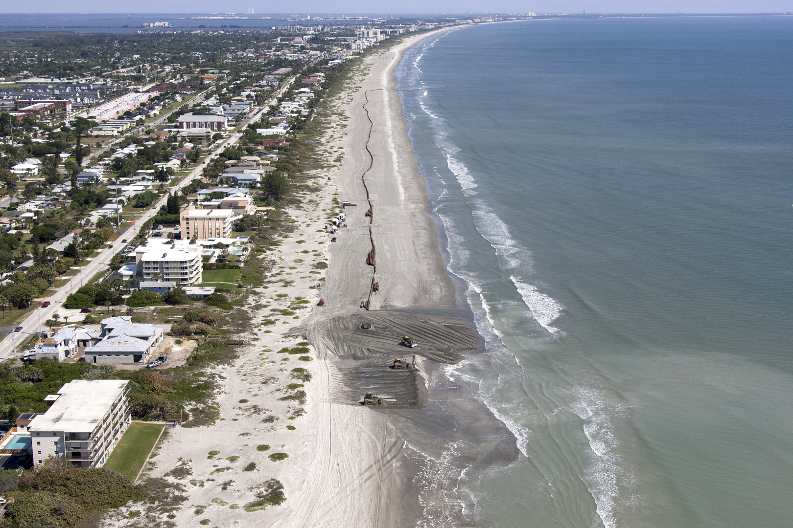 Contractors pump sand onto miles of Brevard County beaches in Florida (Courtesy of United States Army Corps of Engineers, Public Domain, via USACE Jacksonville District website).