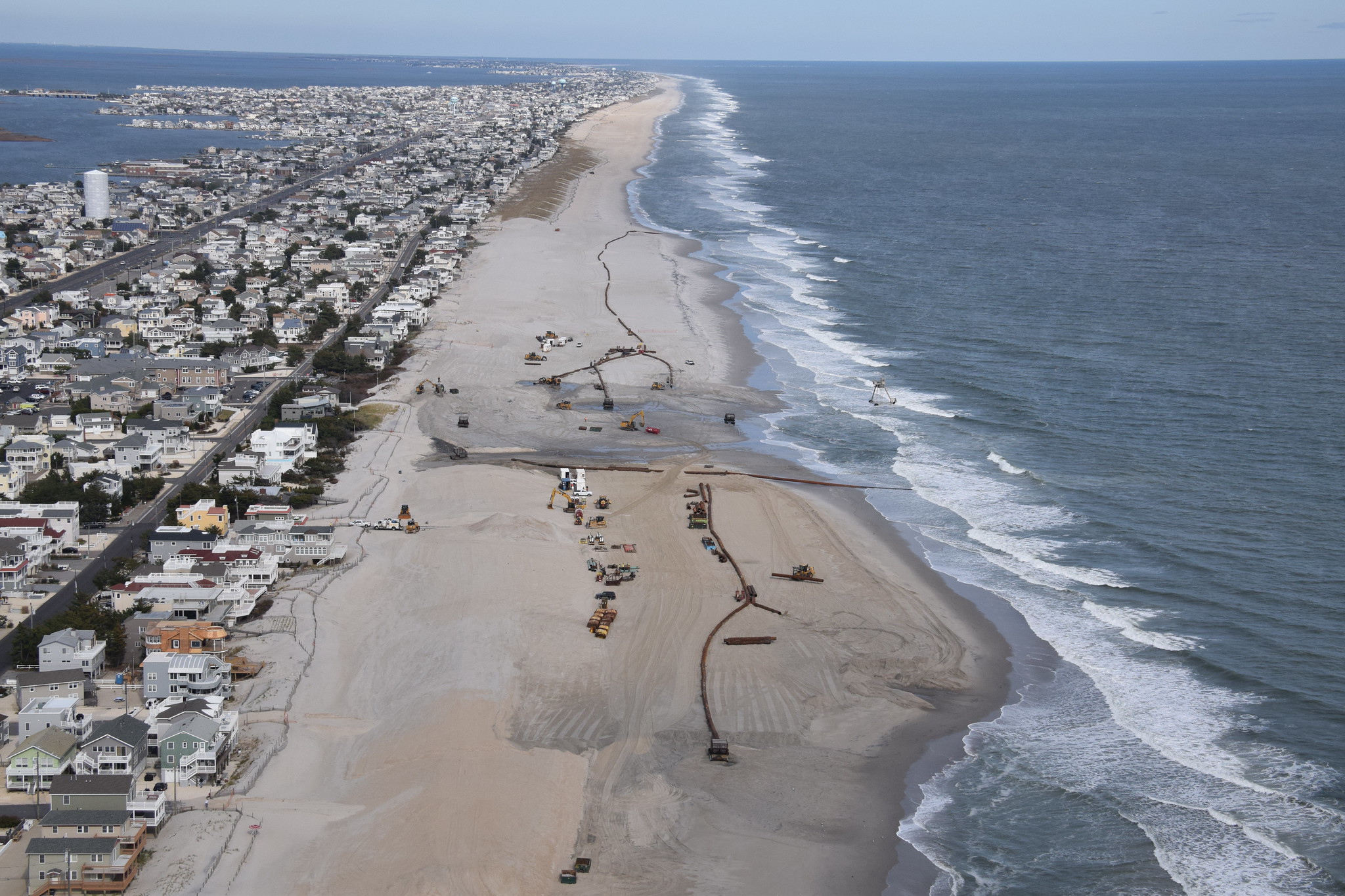 A 2015 U.S. Army Corps of Engineers project on Long Beach Island, NJ pumped more than 8 million cubic yards of offshore sand onto the beach to create a dune and berm system designed to reduce storm damages (Courtesy of U.S. Army Corps of Engineers, public domain, via Flickr).