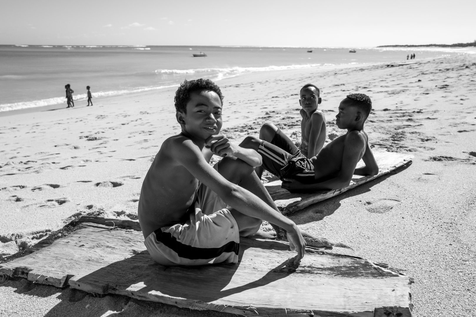 Local village boys using found planks of wood to surf in Madagascar. They were shredding © 2024 Oleg Guerrand-Hermes.