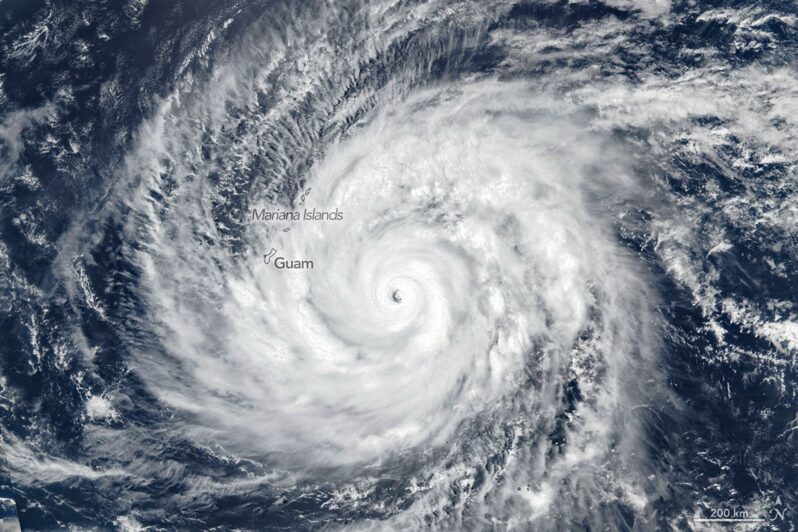 Super Typhoon Sinlaku spins over the North Pacific Ocean in this image acquired on April 13, 2026, with the VIIRS (Visible Infrared Imaging Radiometer Suite) on the Suomi NPP satellite. (courtesy of NASA Earth Observatory | Michala Garrison, public domain).